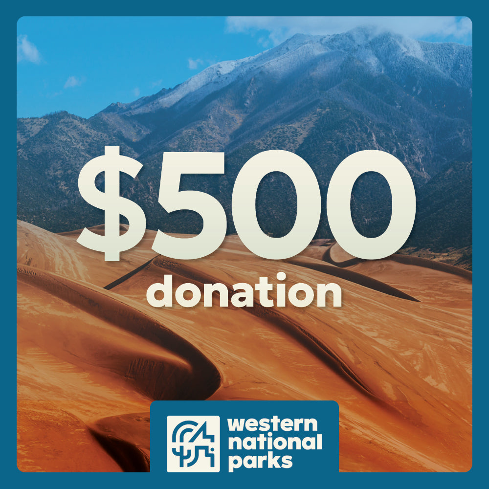 Desert landscape with mountains and '$500 donation' text overlay, featuring Western National Parks logo.